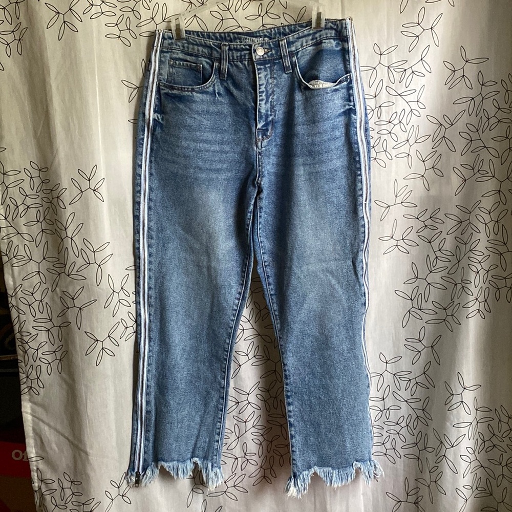 High rise straight leg ankle jeans w/ distressed and zipper detail.